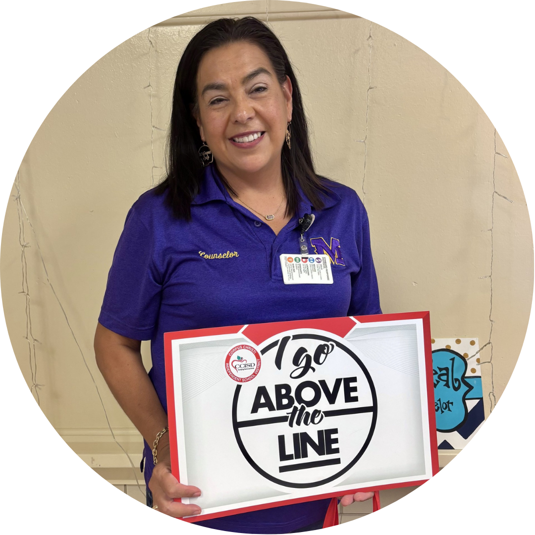 A woman in a purple shirt holds a sign with white text "120 ABOVE the LINE" in black.