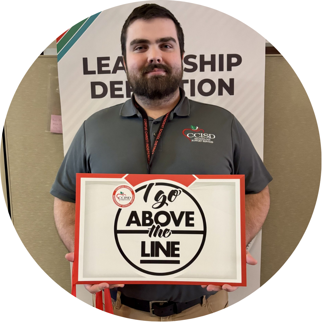 Person in front of a banner with text "Leadership Dedication." Holding a sign saying "120 Above the Line."
