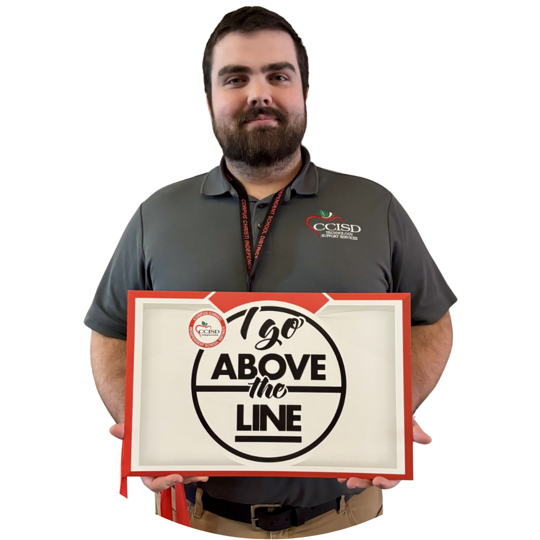 A man holds a sign that reads "120 Above the Line" with a logo. He wears a gray shirt and has a beard.