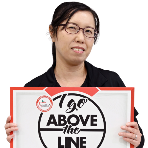 A woman with glasses holds a sign that reads "1go ABOVE the LINE." The sign has a red border and a white background.