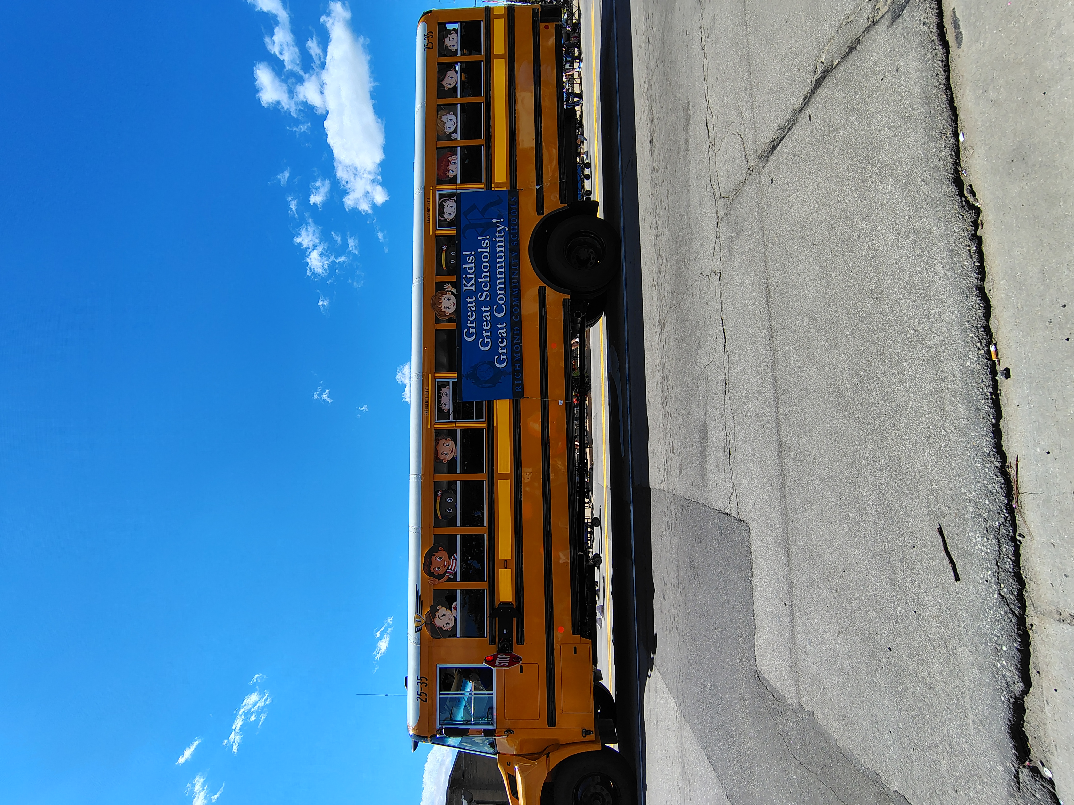 School bus passing during a parade