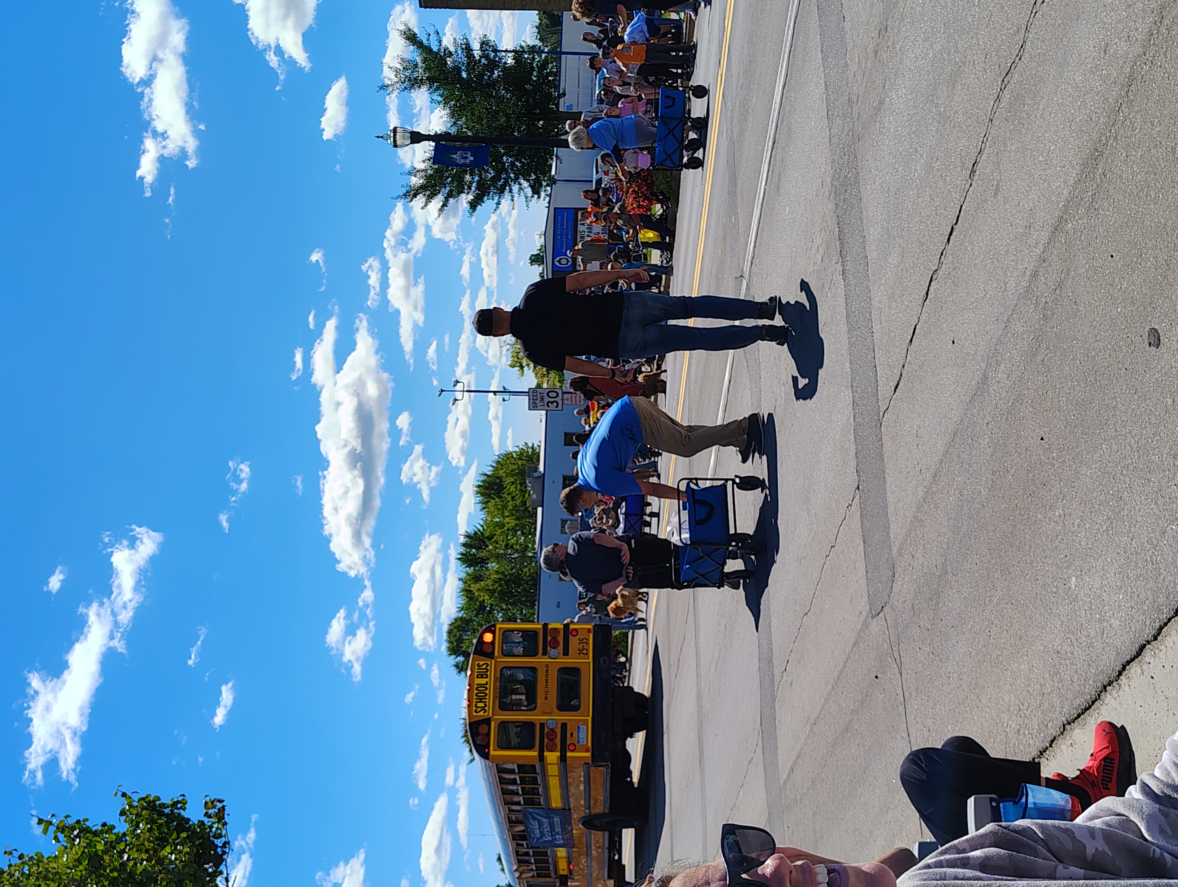 School busses passing during a parade