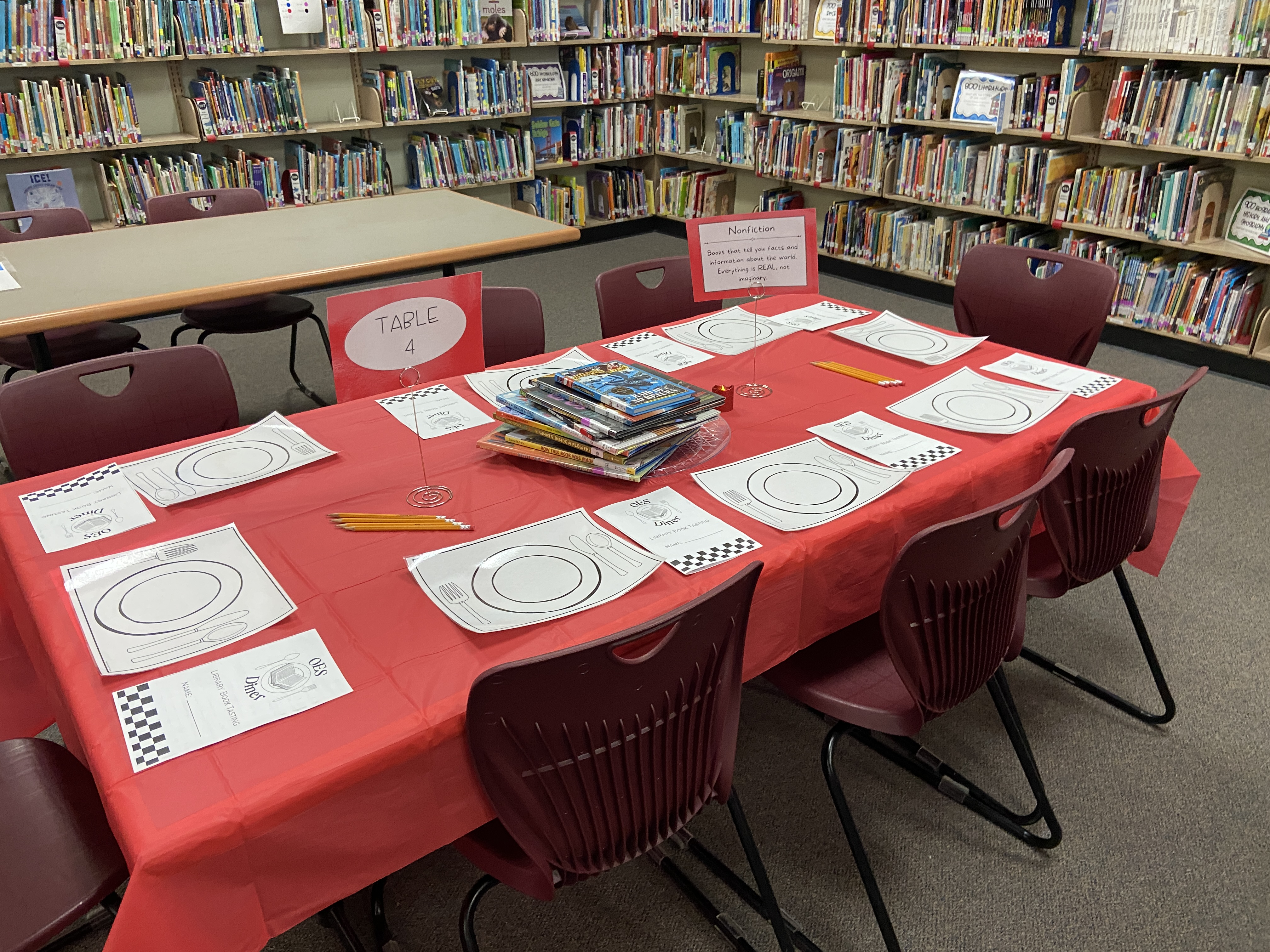 photo of a table in the library set up as a dining table