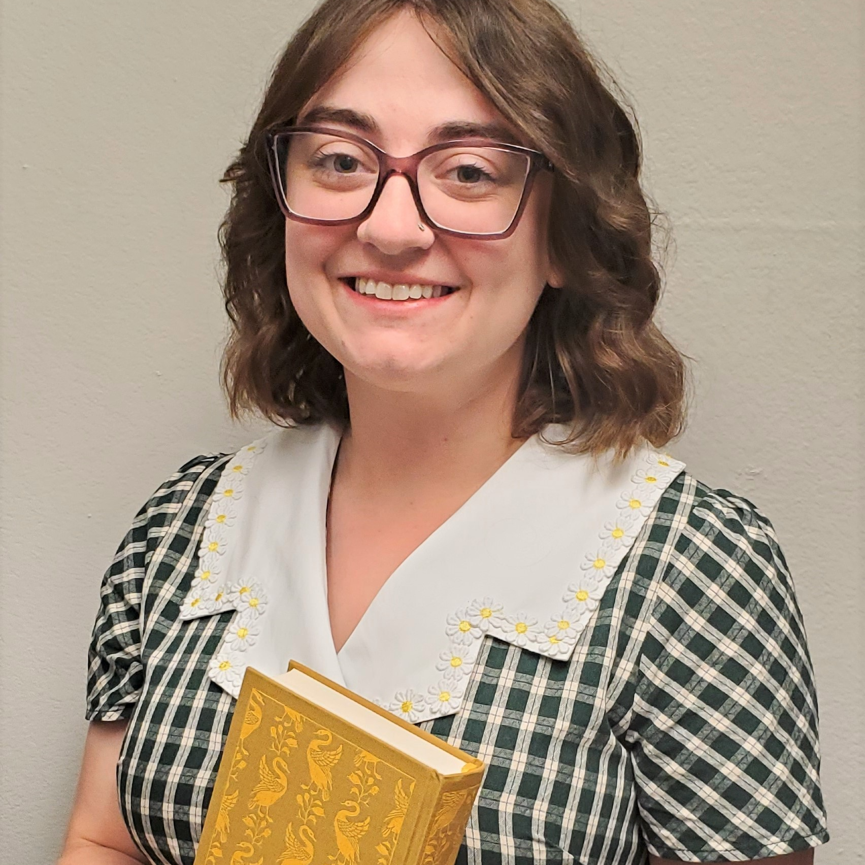 a woman holding a book