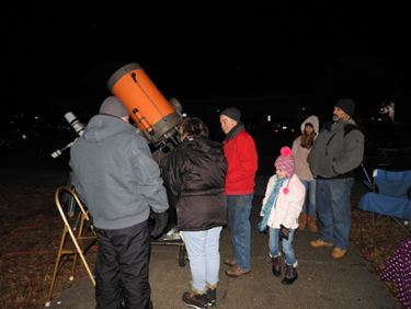 Chesapeake Planetarium telescope being used by patrons outisde
