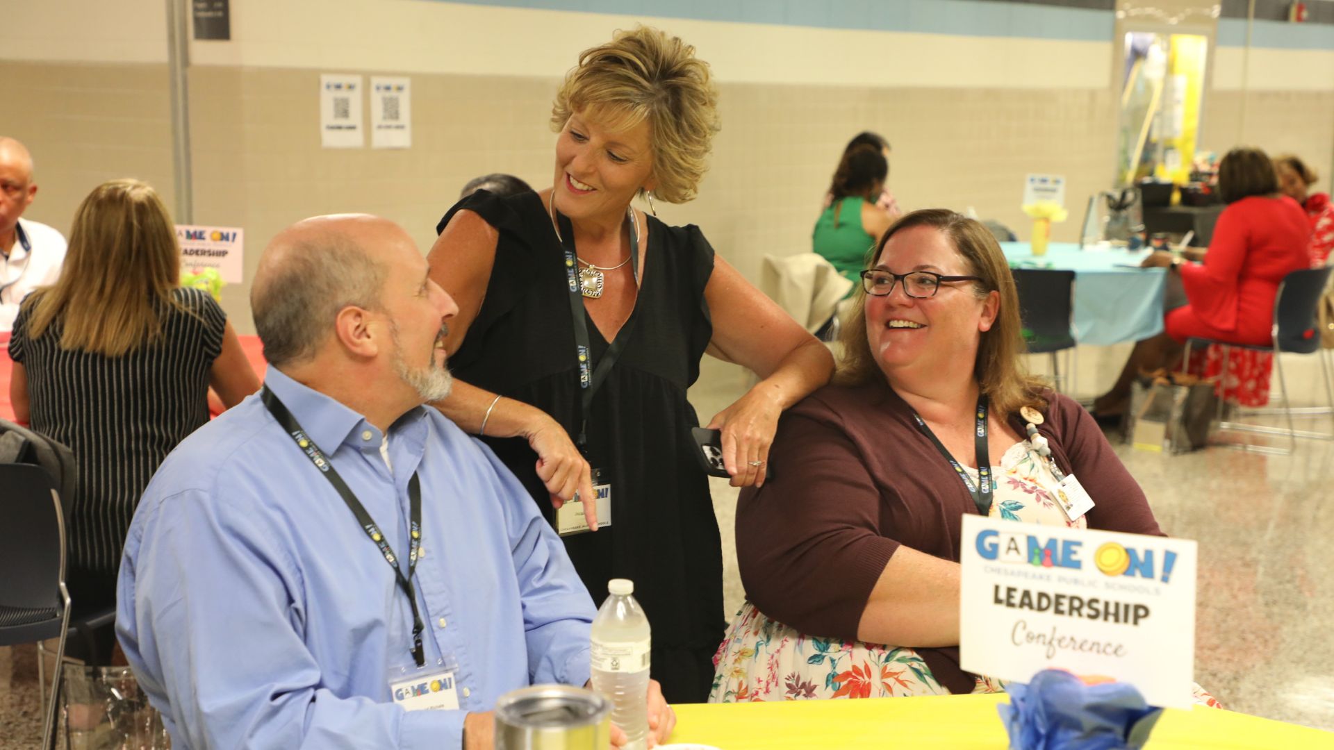 Administrators chat during the summer Empower Admin Conference.