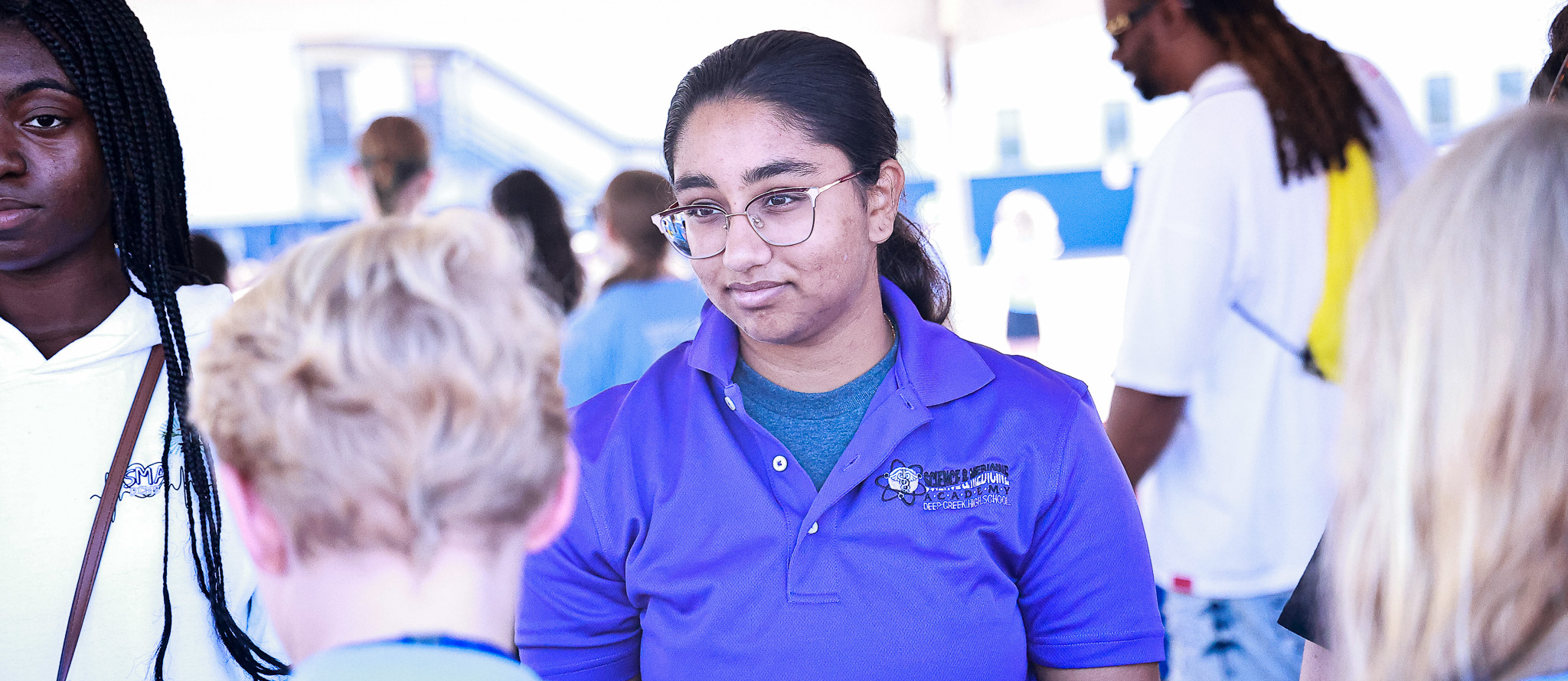 An Deep Creek SMA student works a booth at the NSA Oceana Airshow