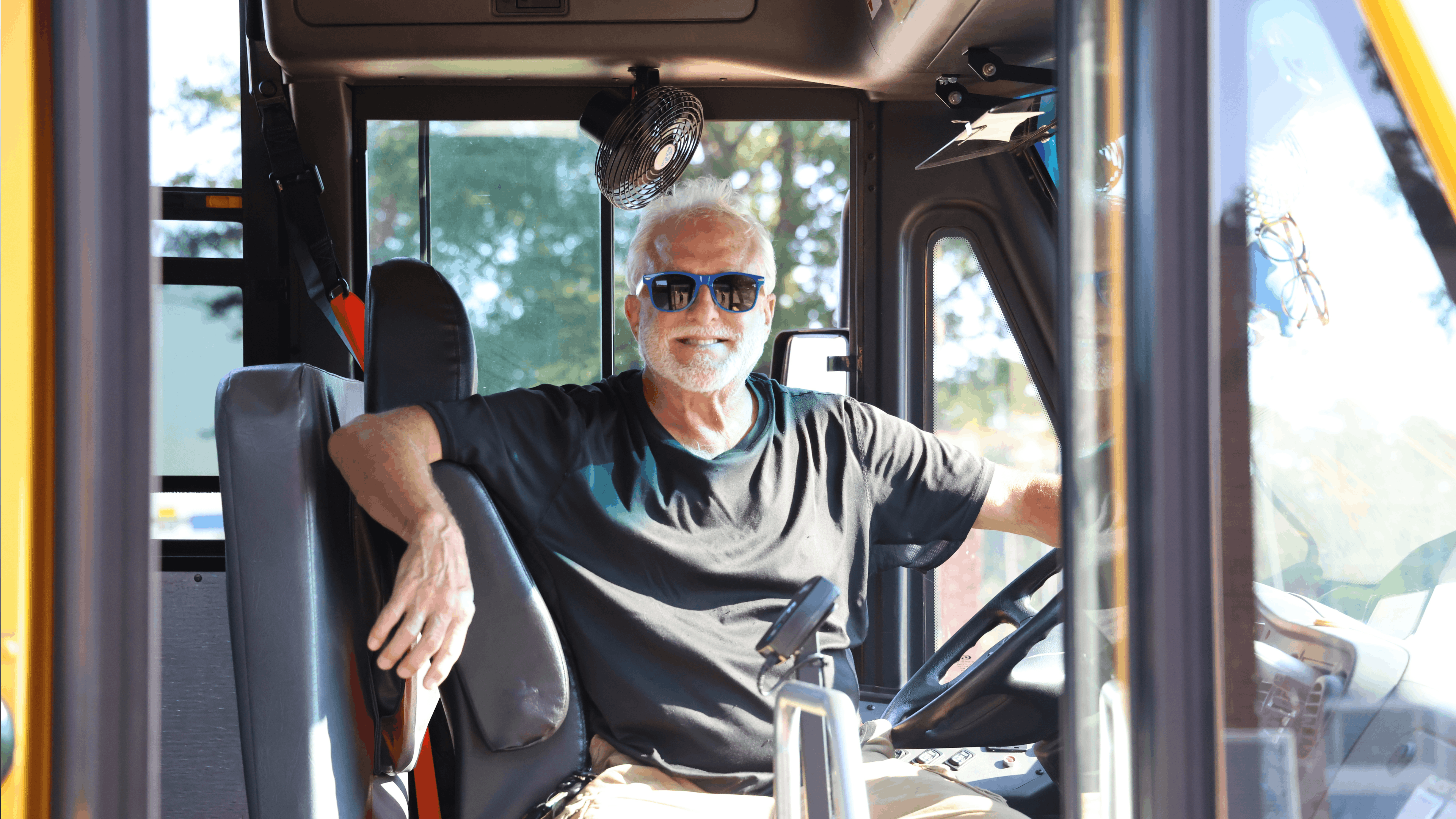 A Chesapeake Public Schools bus driver smiles for a posed picture