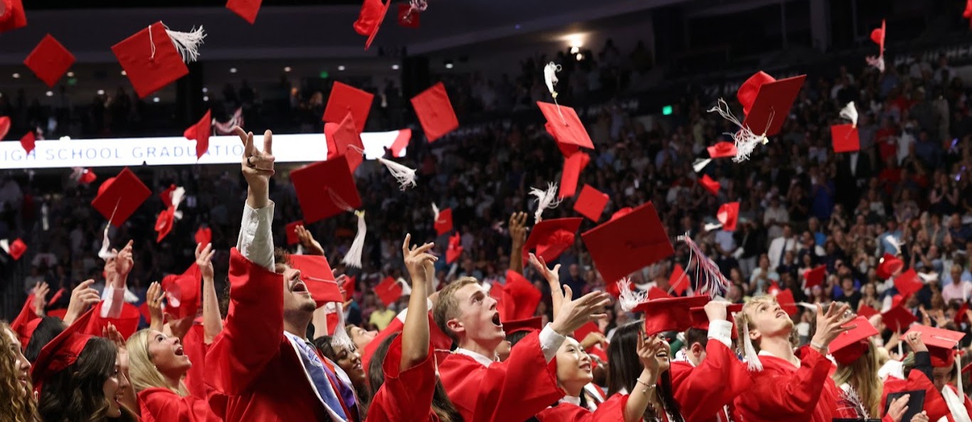 The Grassfield High School Class of 2026 throws their caps into the air after graduating