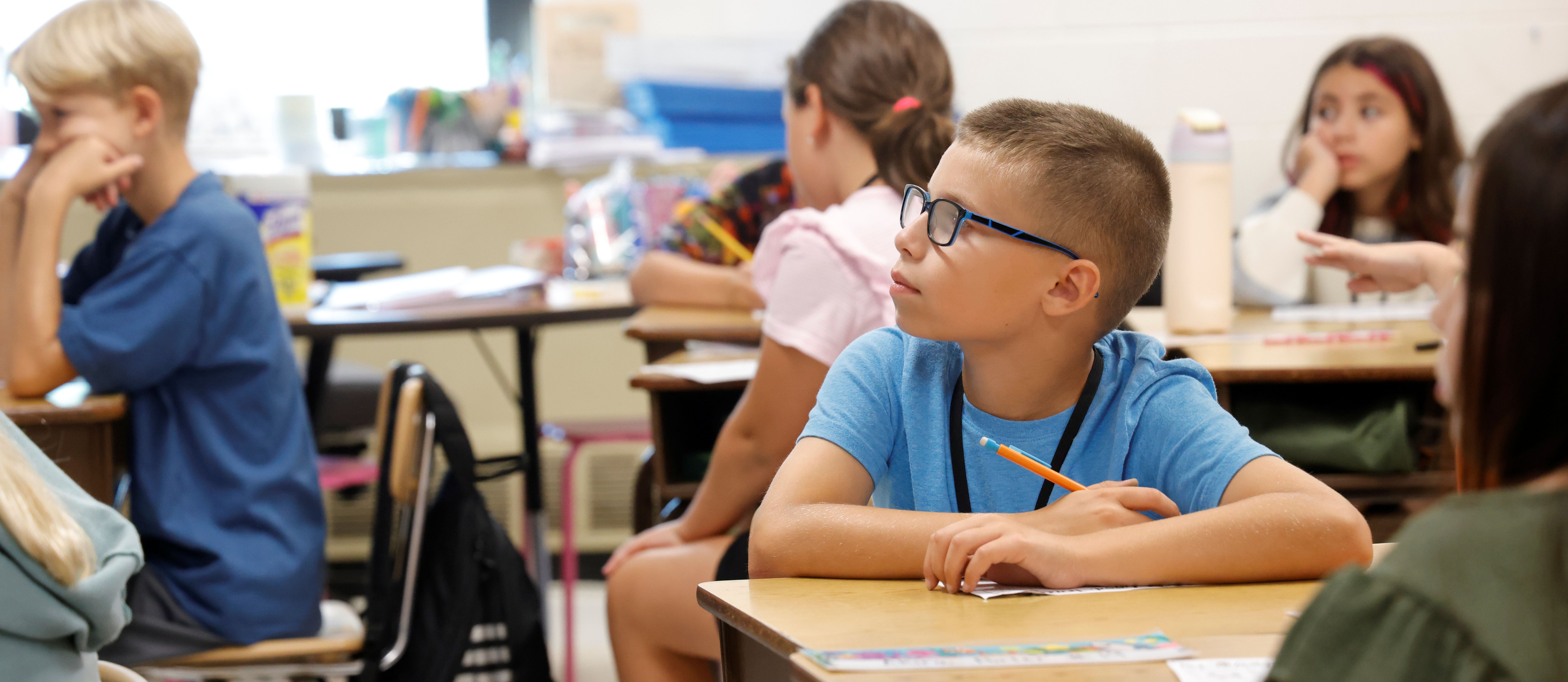 A student listening intently to his teacher