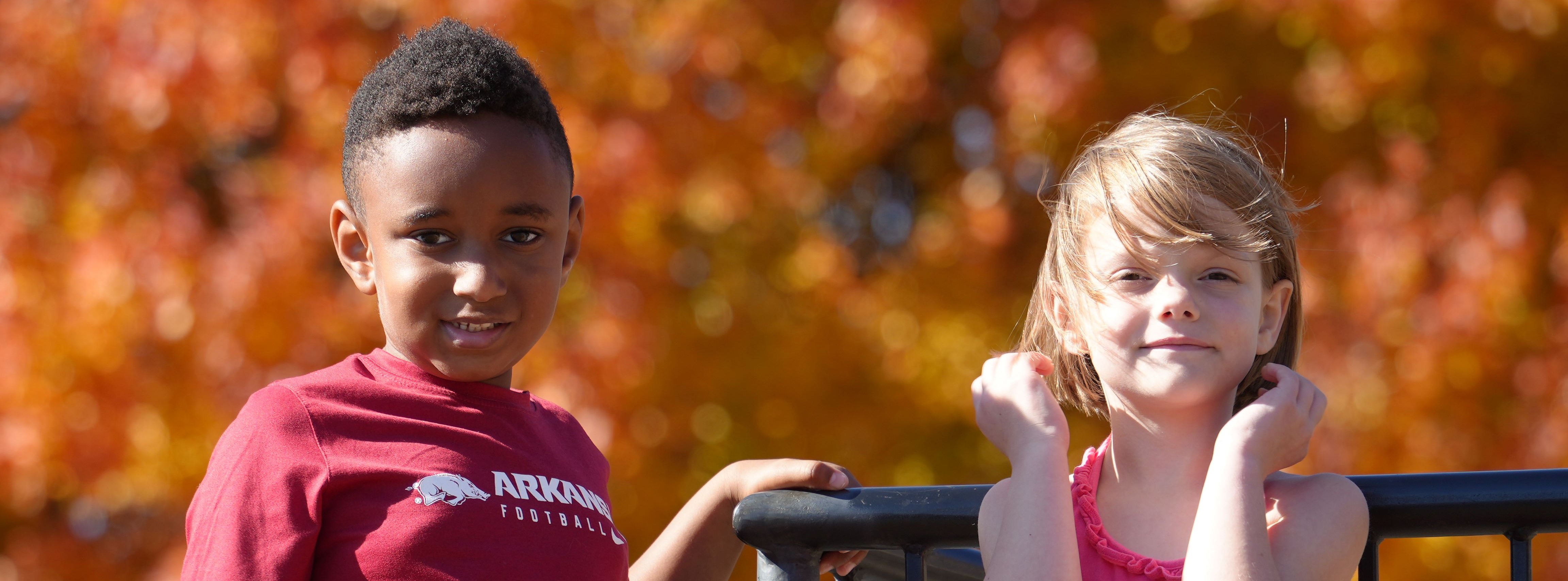 Students playing on the playground in fall.