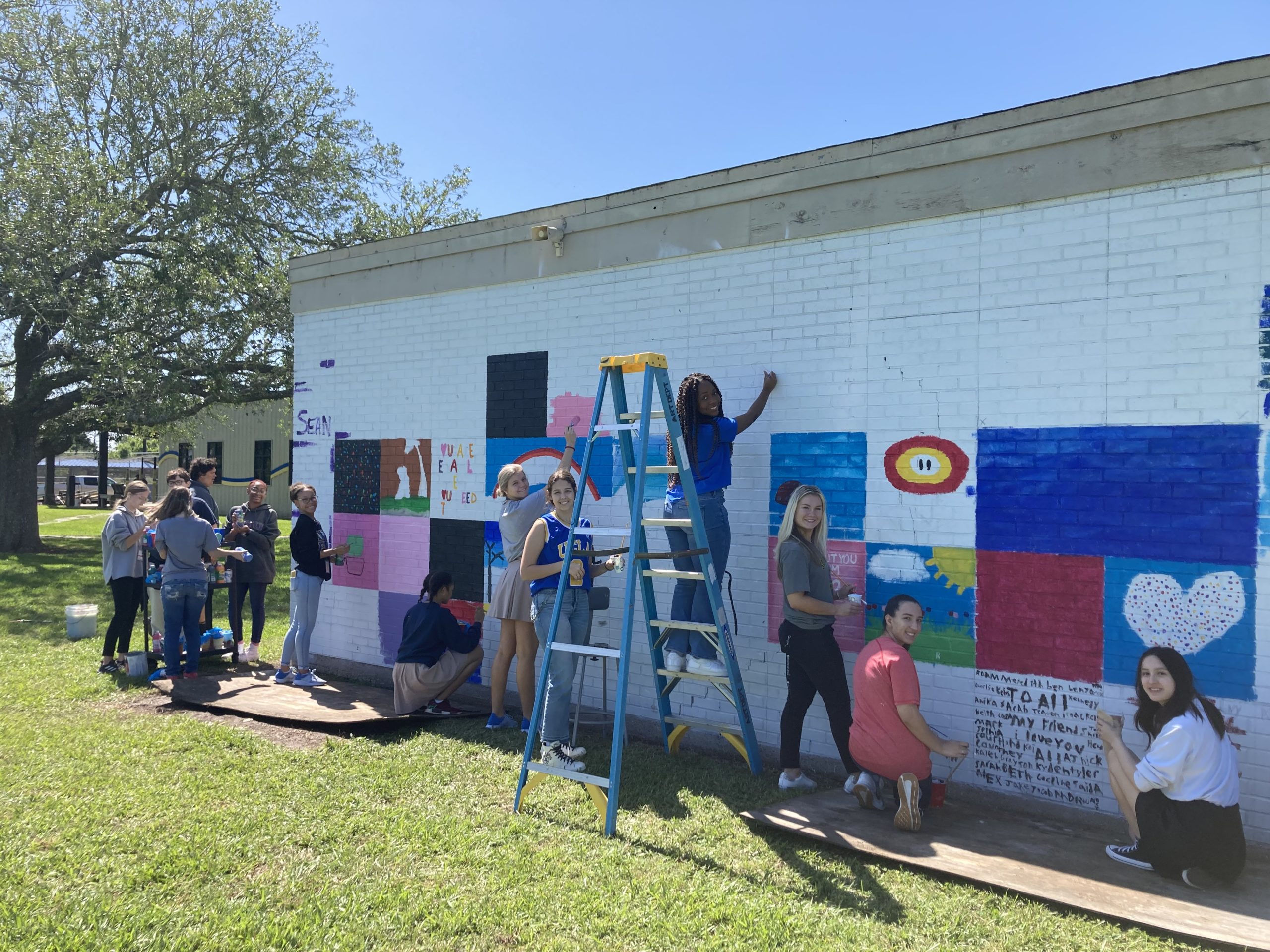 Students painting walls