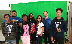 student film crew in front of a green screen 