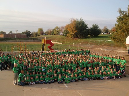 group picture of students in their green shirts