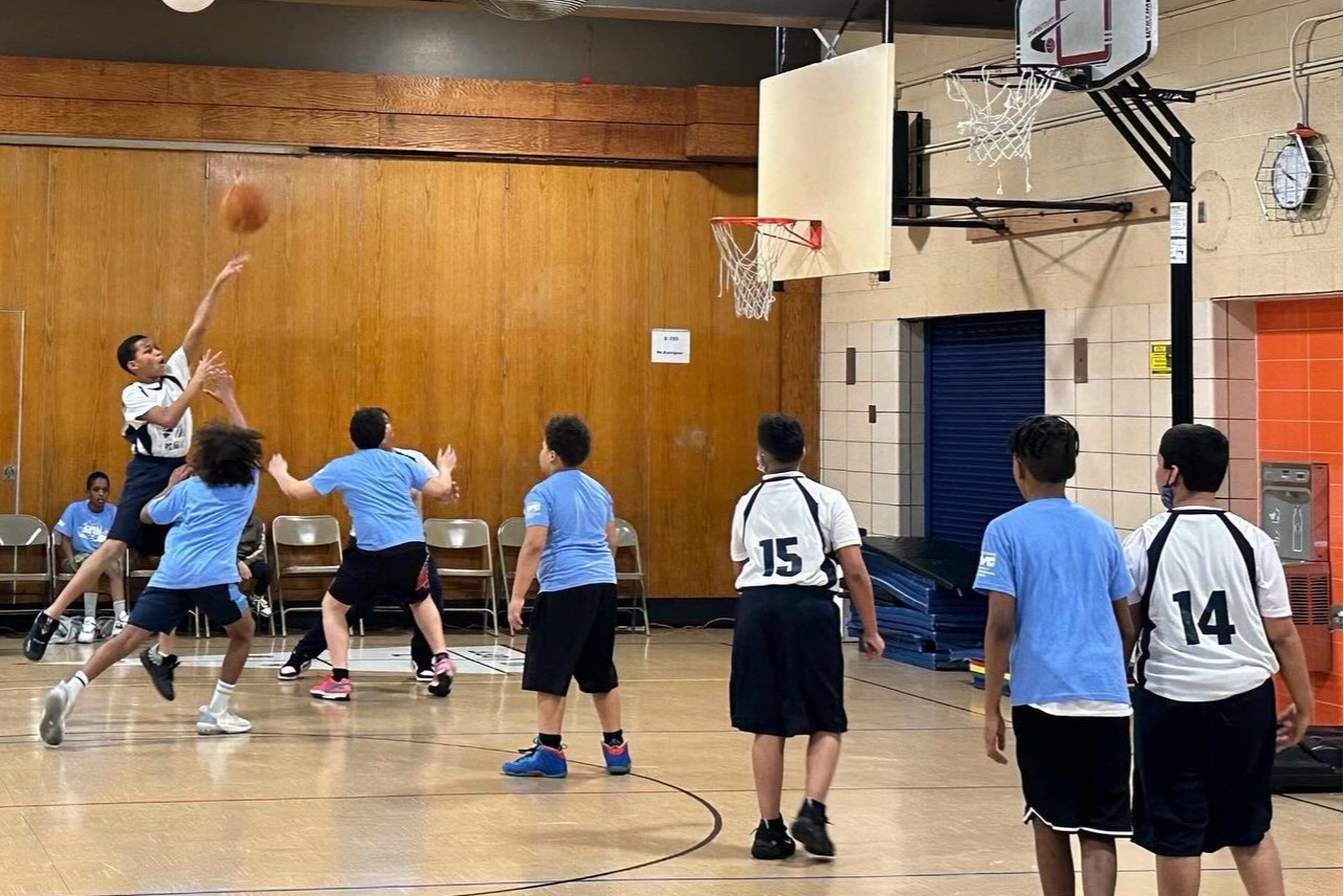 students playing basketball