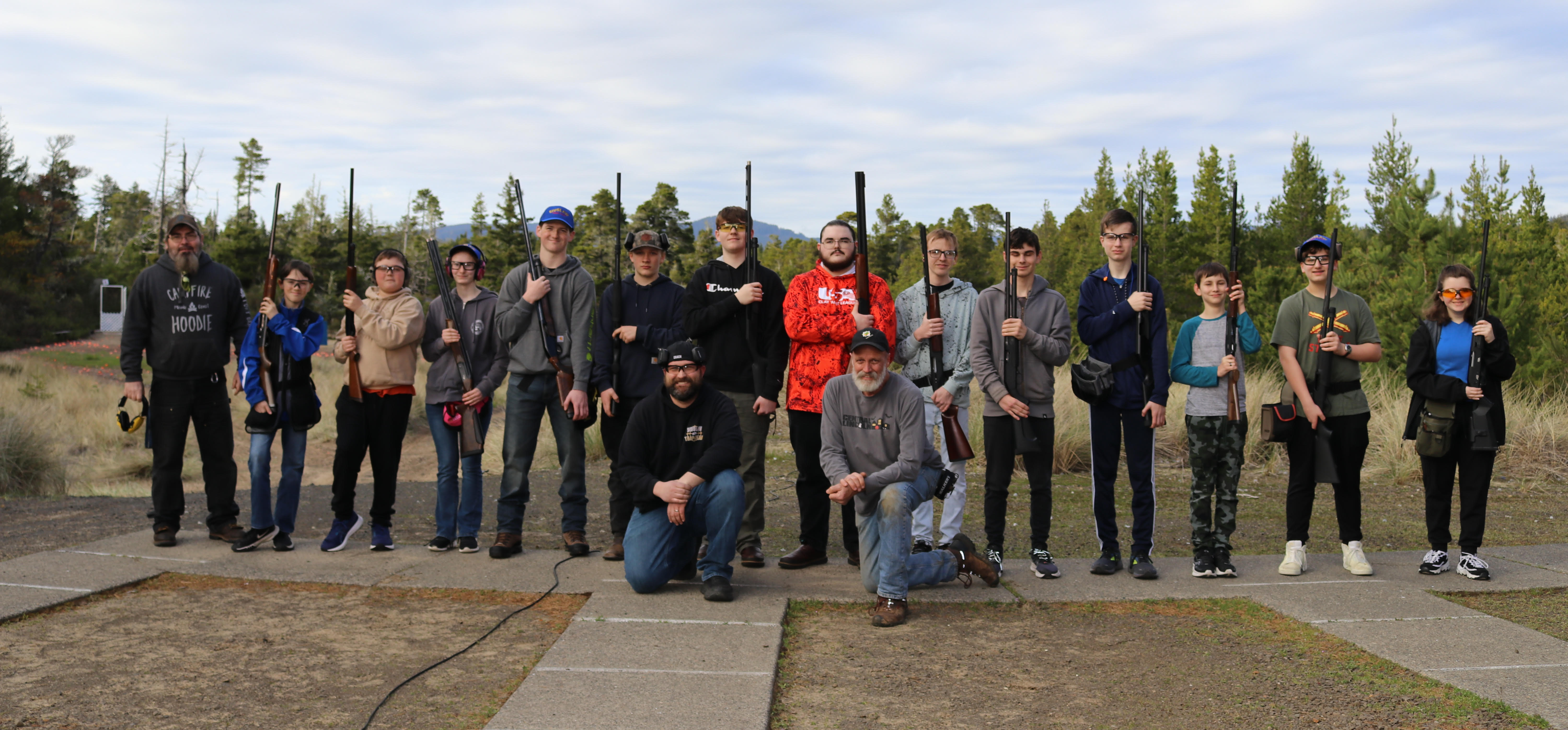Trap Team and coaches at the range