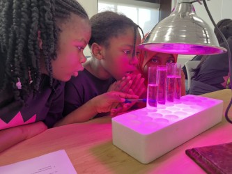 Girls who game team participating in science experiment