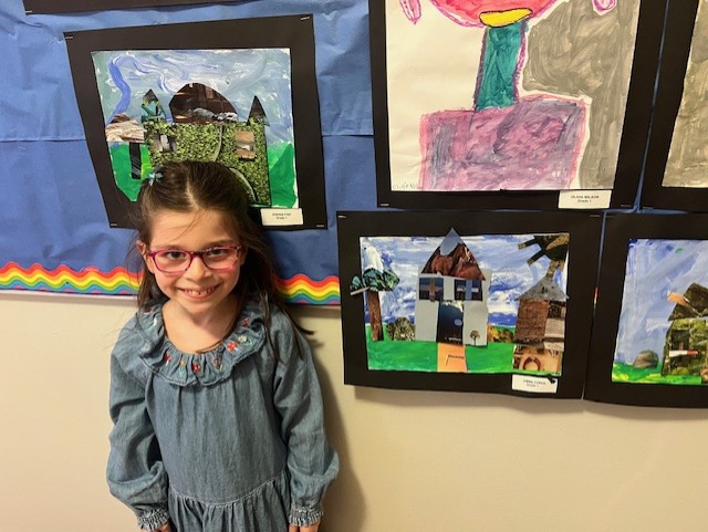 student with her artwork