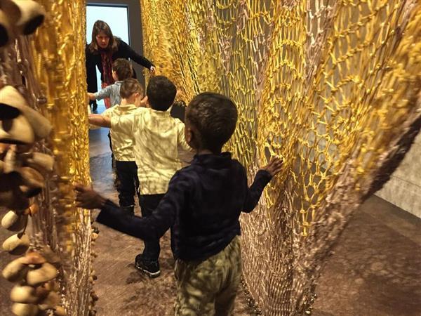 students walking between walls