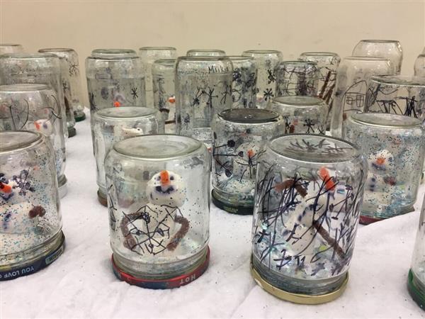 snowmen in glass jars