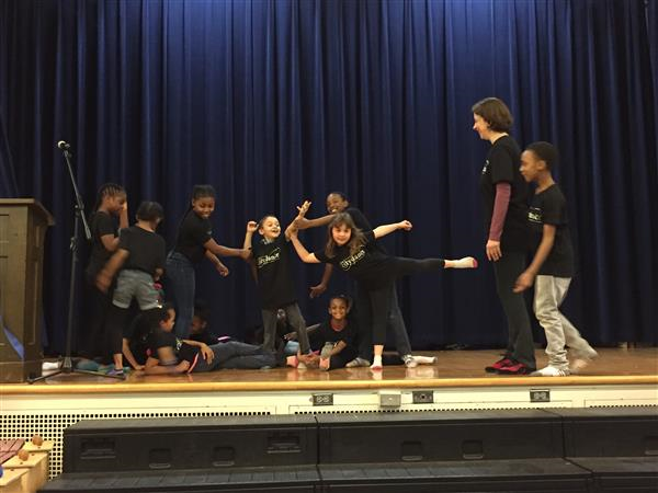 students performing on stage