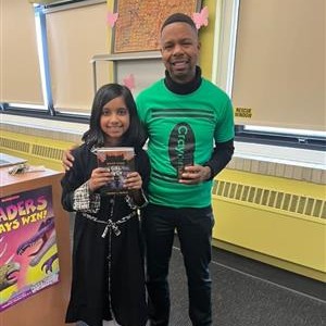 Teacher and student with book from Book Vending Machine