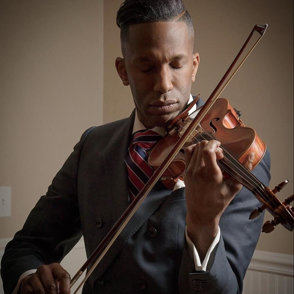 Henri L. Muhammad director- Pictured playing violin