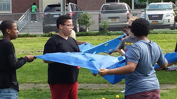 Students holding a tarp