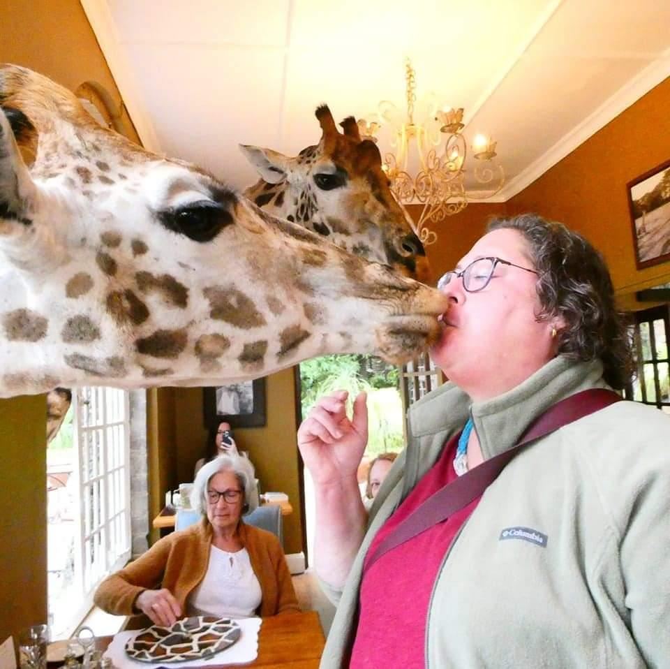 ms kristal kissing a giraffe