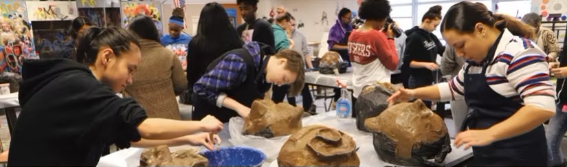Students making clay sculptures