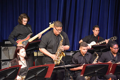 Students Performing on Stage Musical  Sax