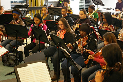 Students Performing on Stage Musical String