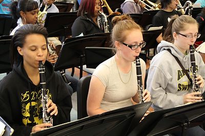 Students Performing on Stage Musical  Sax