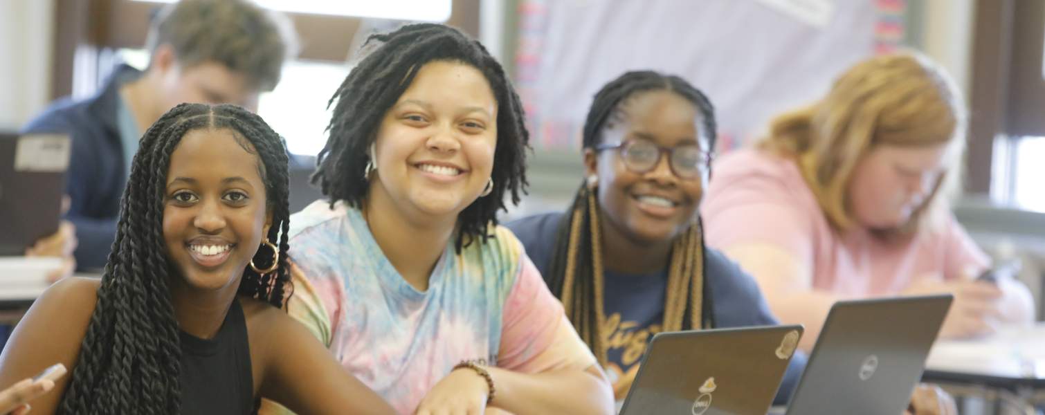Students smiling in classroom