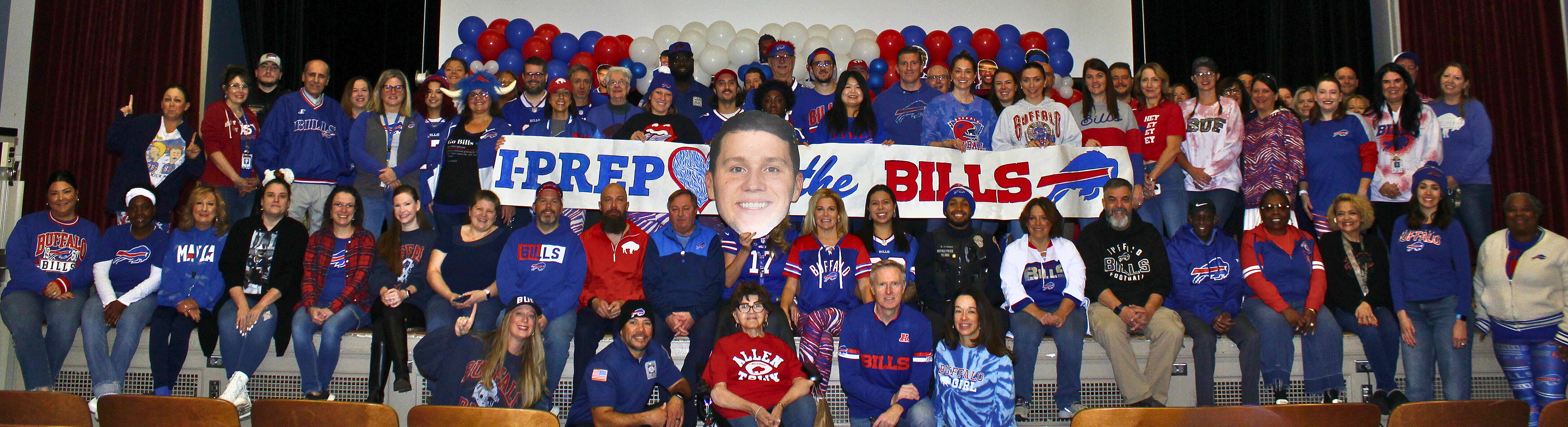 Faculty photo with Buffalo Bills attire.