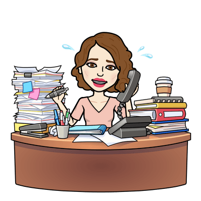 a clip art of Ms. Marren sitting behind her desk with piles of books and papers