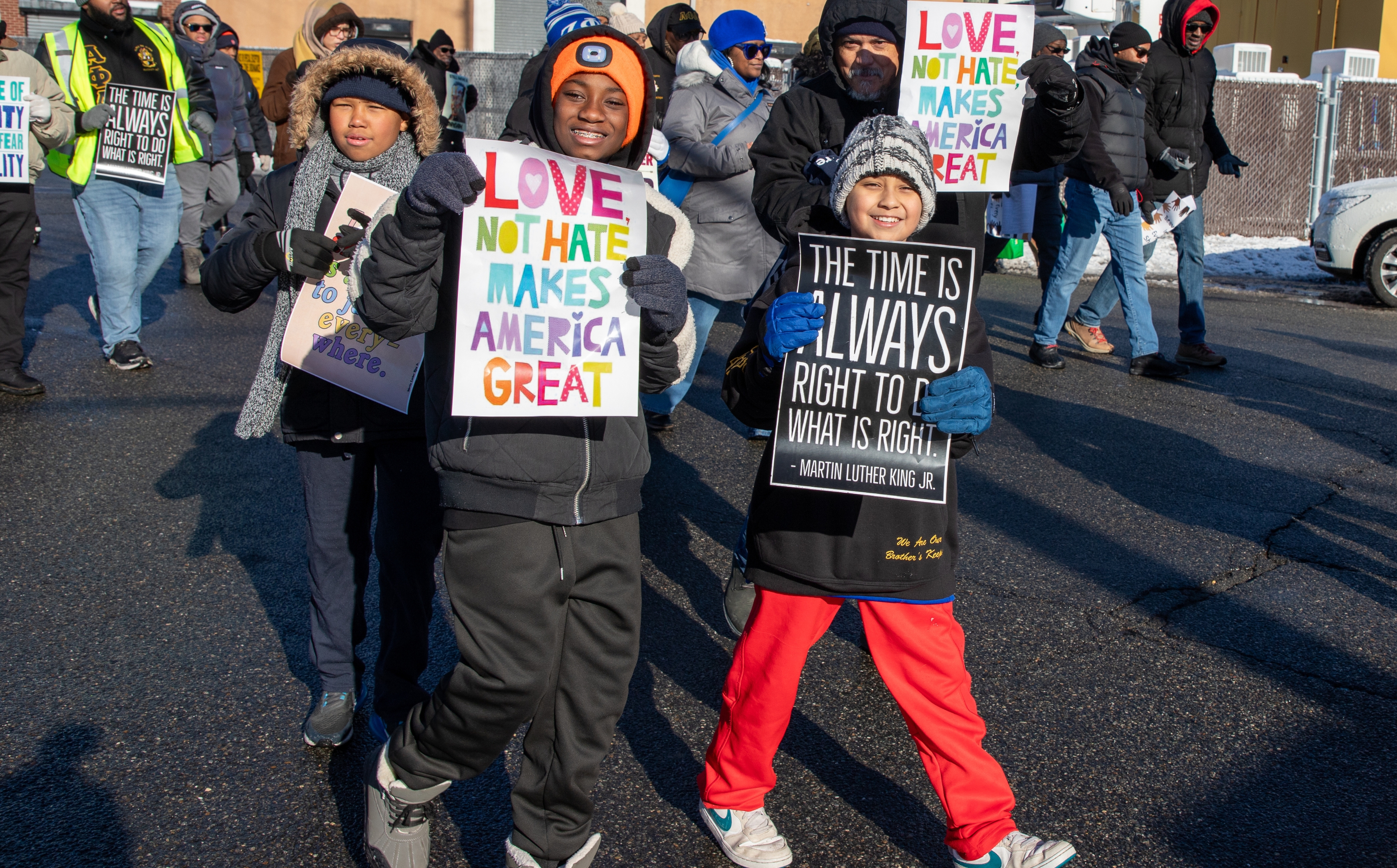 Students holding sign