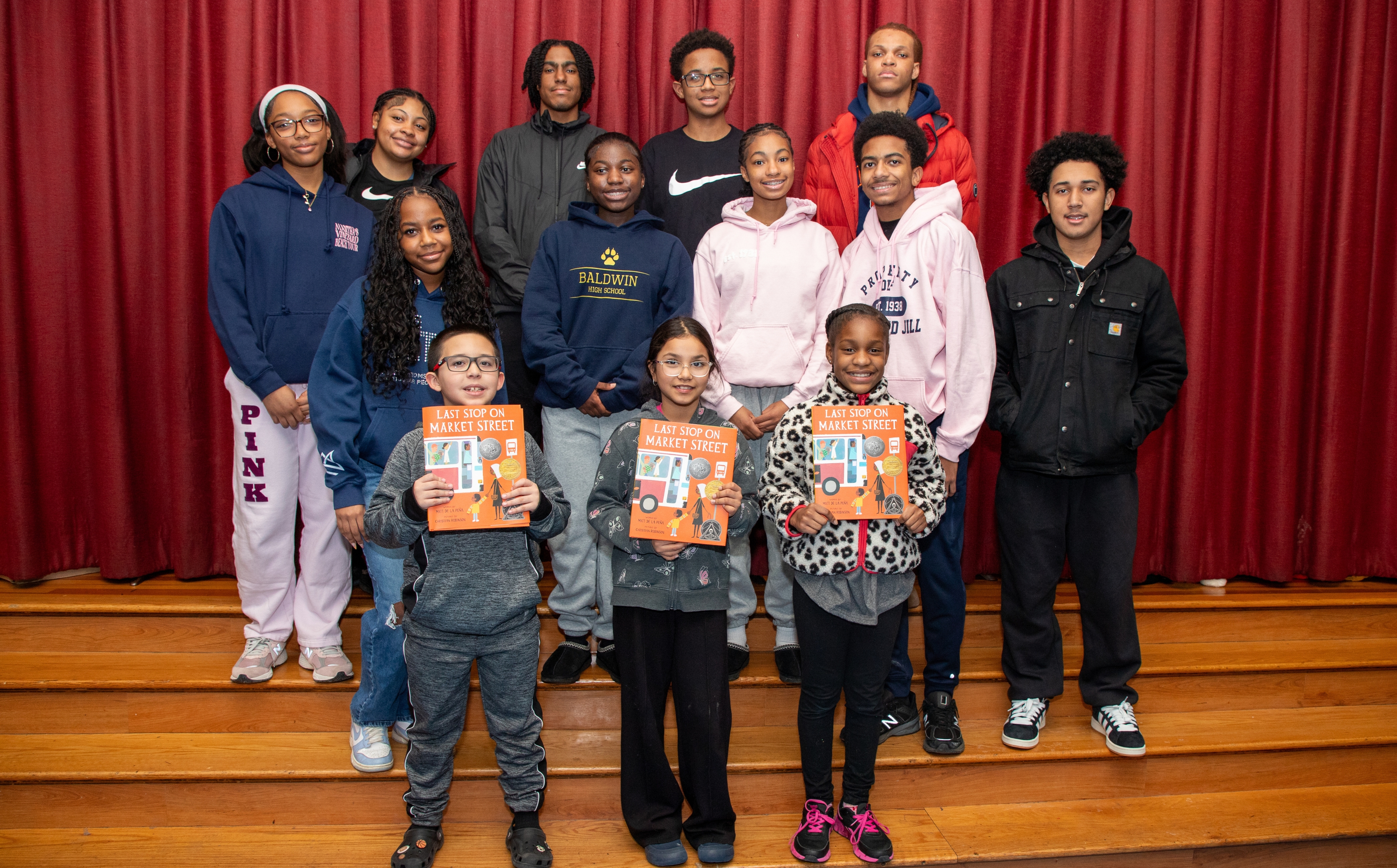 Students holding their book