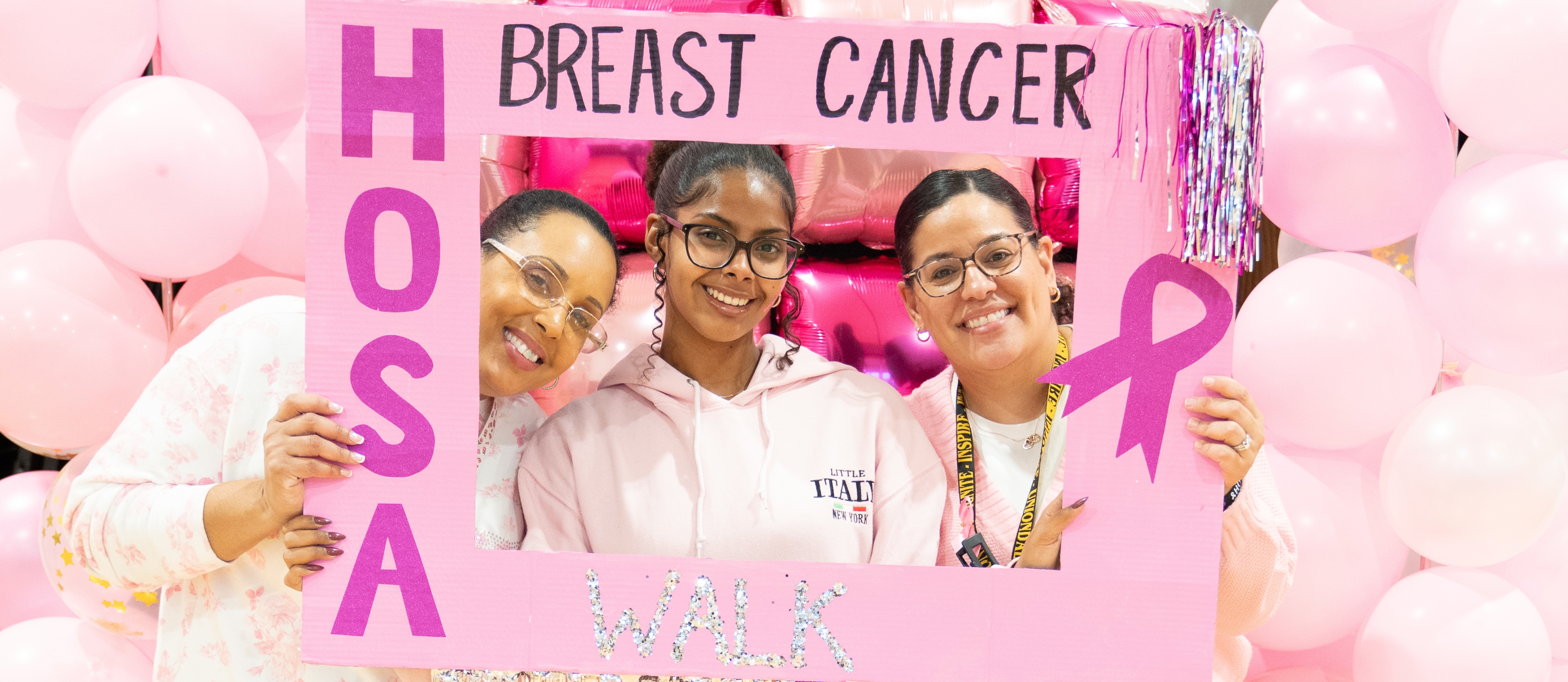 Uniondale High School's Health Occupations Students of America-Future Health Professionals organized a Breast Cancer Walk to raise awareness about breast cancer and to show support for survivors.  Although the walk was planned for outdoors, the rainy weather caused the walk organizers to pivot to an indoor event.  Our HOSA scholars rose to the challenge and created a fun and engaging event for all! 