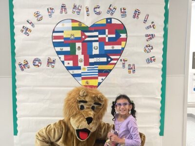 Girl with Lion mascot  