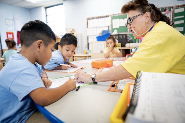 Preschool teacher and students