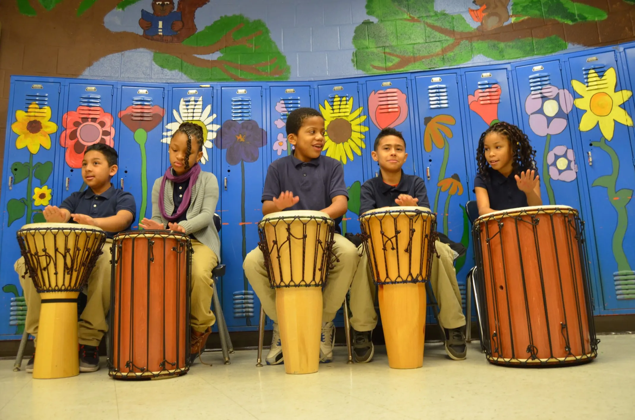 Group of kids playing bongos