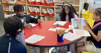 Kids reading at the library