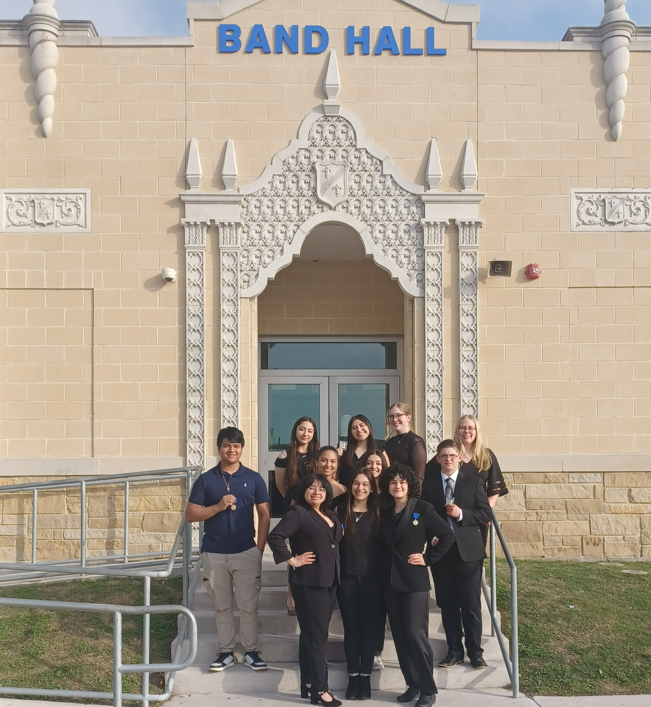 STUDENTS IN FRONT OF BAND HALL
