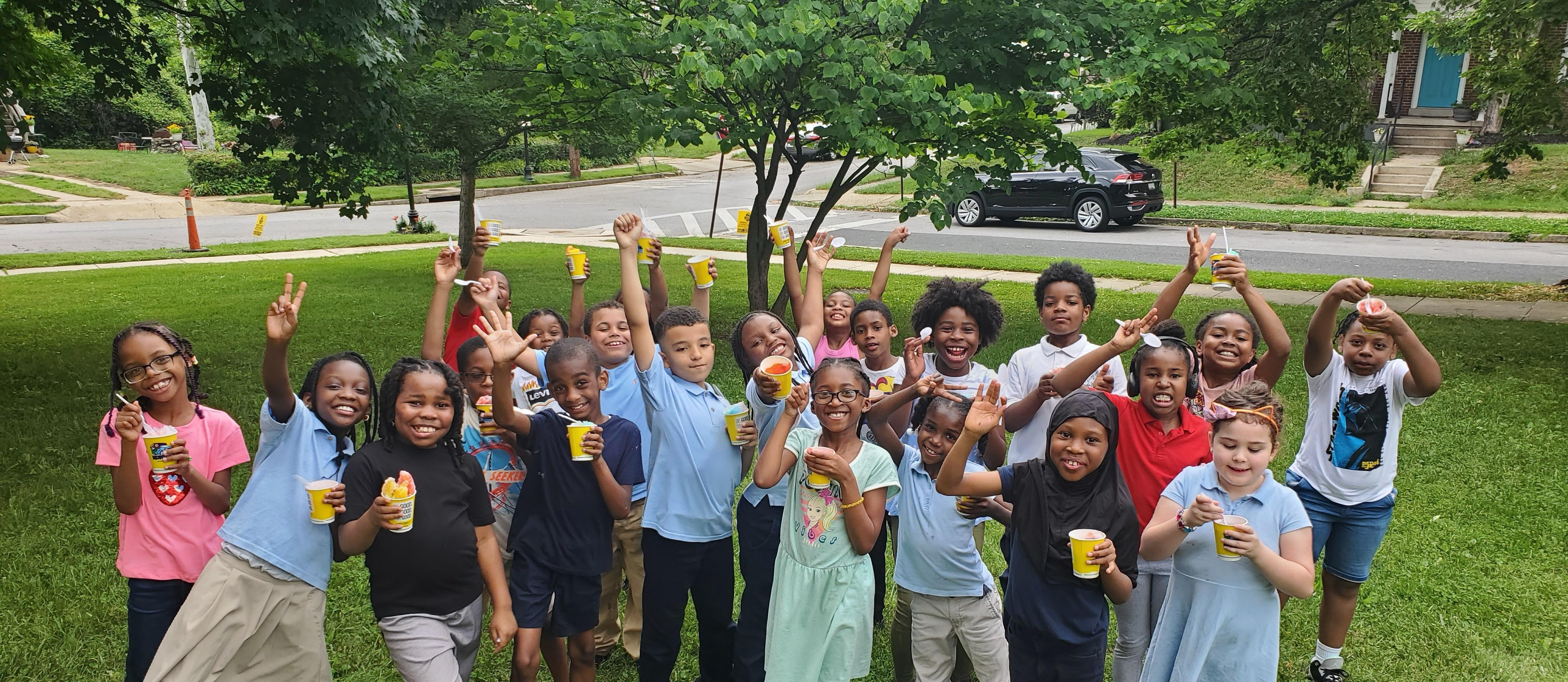 students outside eating a frozen treat