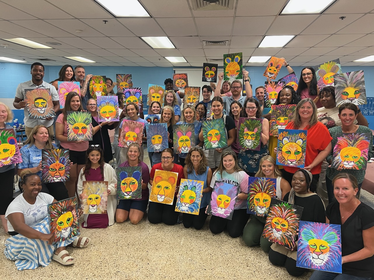 TJEMS Staff with Lion Paintings