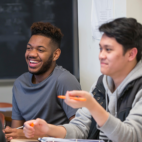 Two Students Smiling at Class