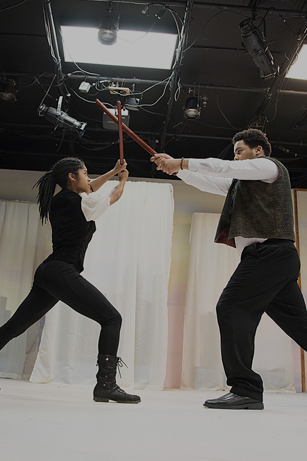 Two students practicing a fight coreography