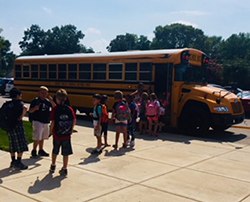 Students getting on bus