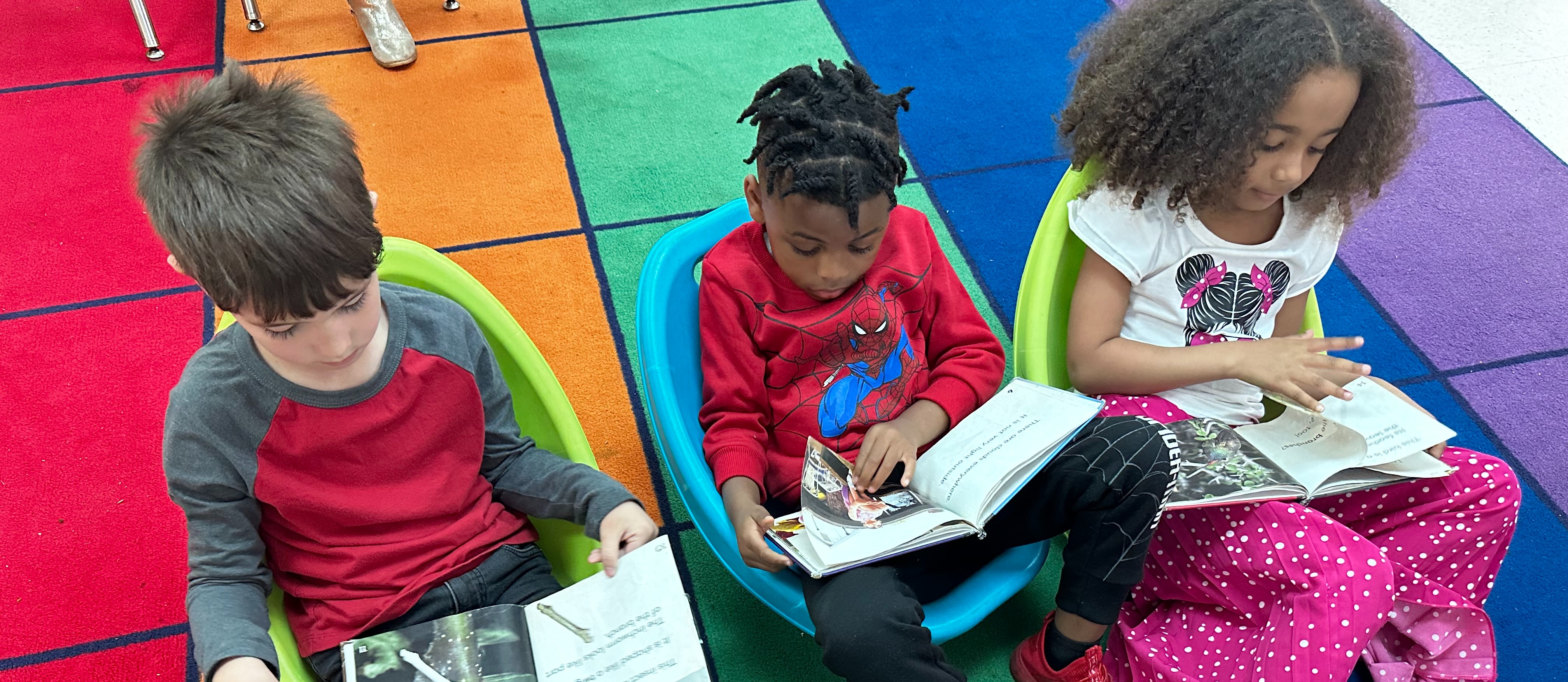 kindergarten students reading at TJ